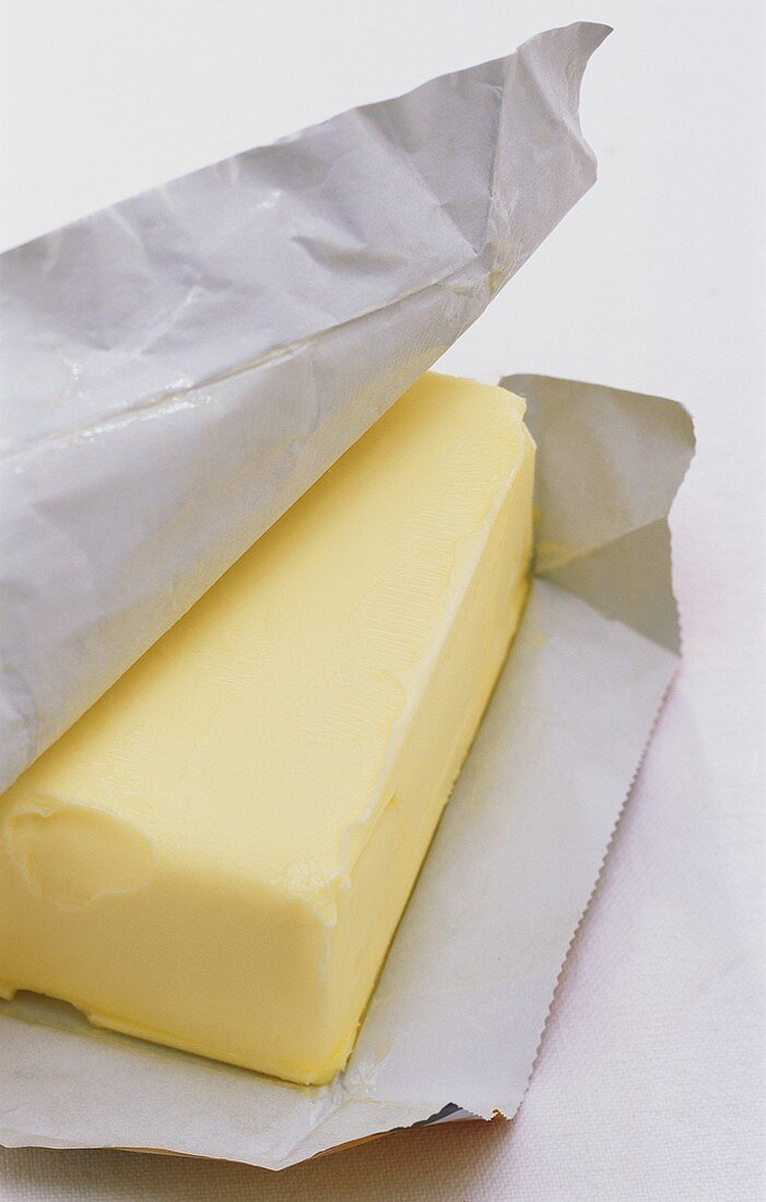 A block of butter wrapped in paper