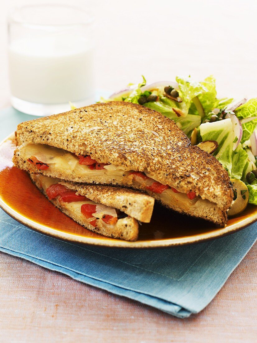 Toasted cheese and pepper sandwich with salad leaves