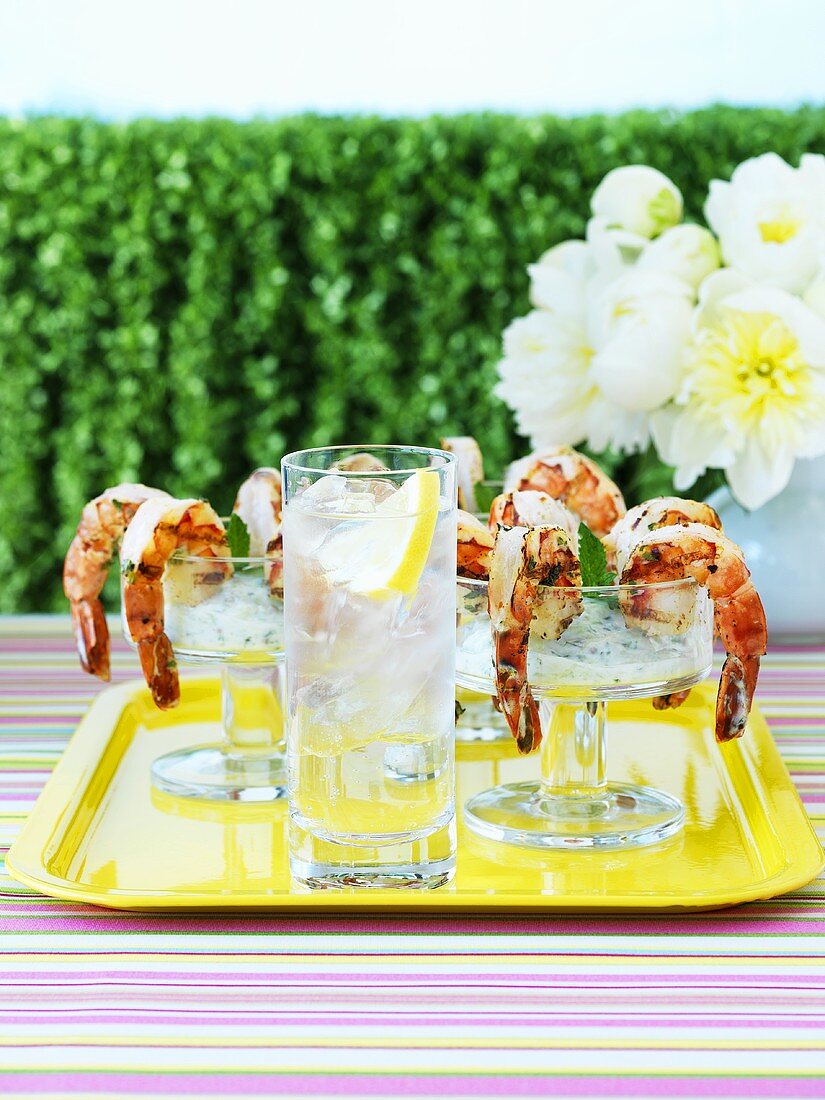 Prawns with spicy cucumber dip in cocktail glasses