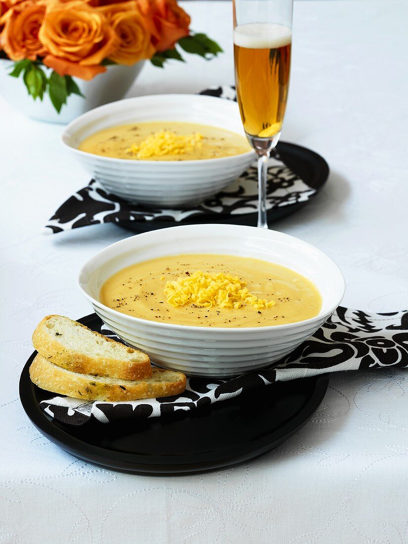 Cheese soup with bread and glass of beer