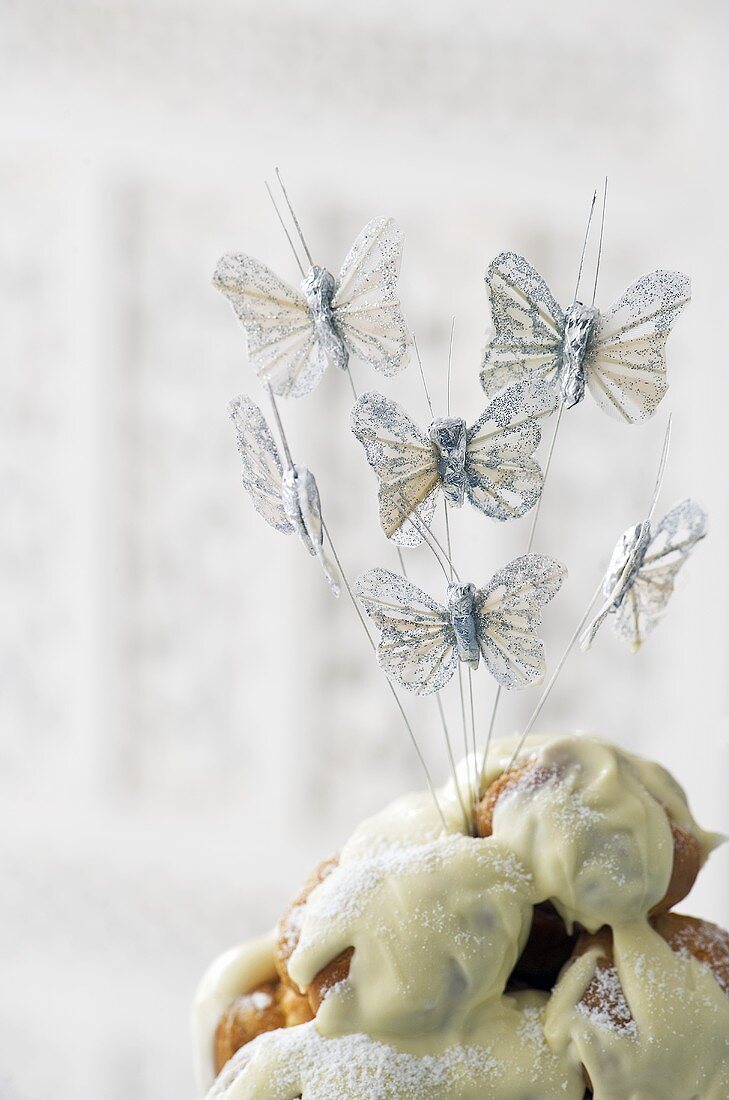 Iced cake with butterfly decoration