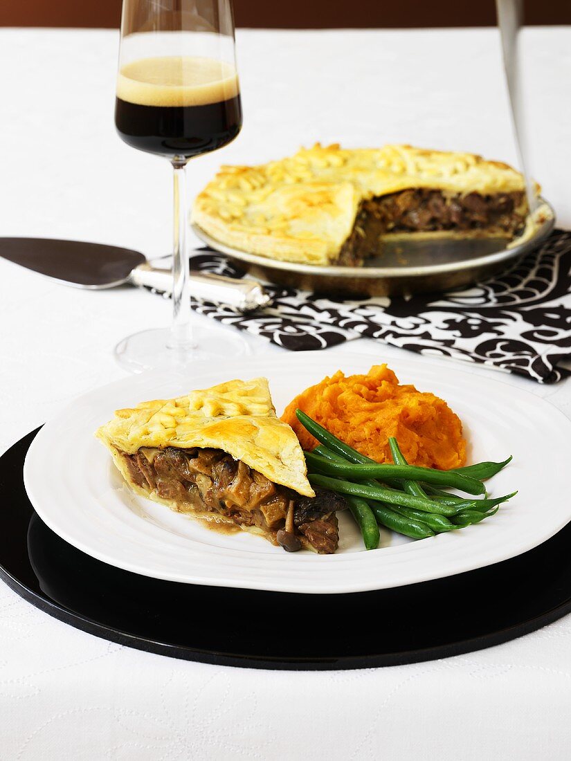 Venison and mushroom pie with pumpkin puree and green beans