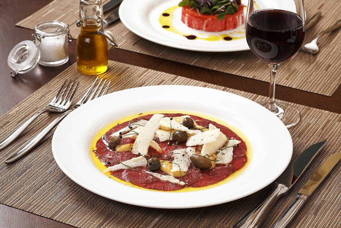Beef carpaccio with olives and Parmesan