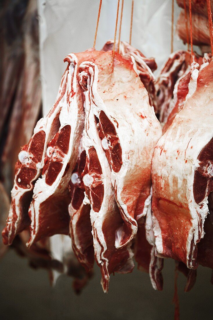 Sections of saddle of lamb at a market