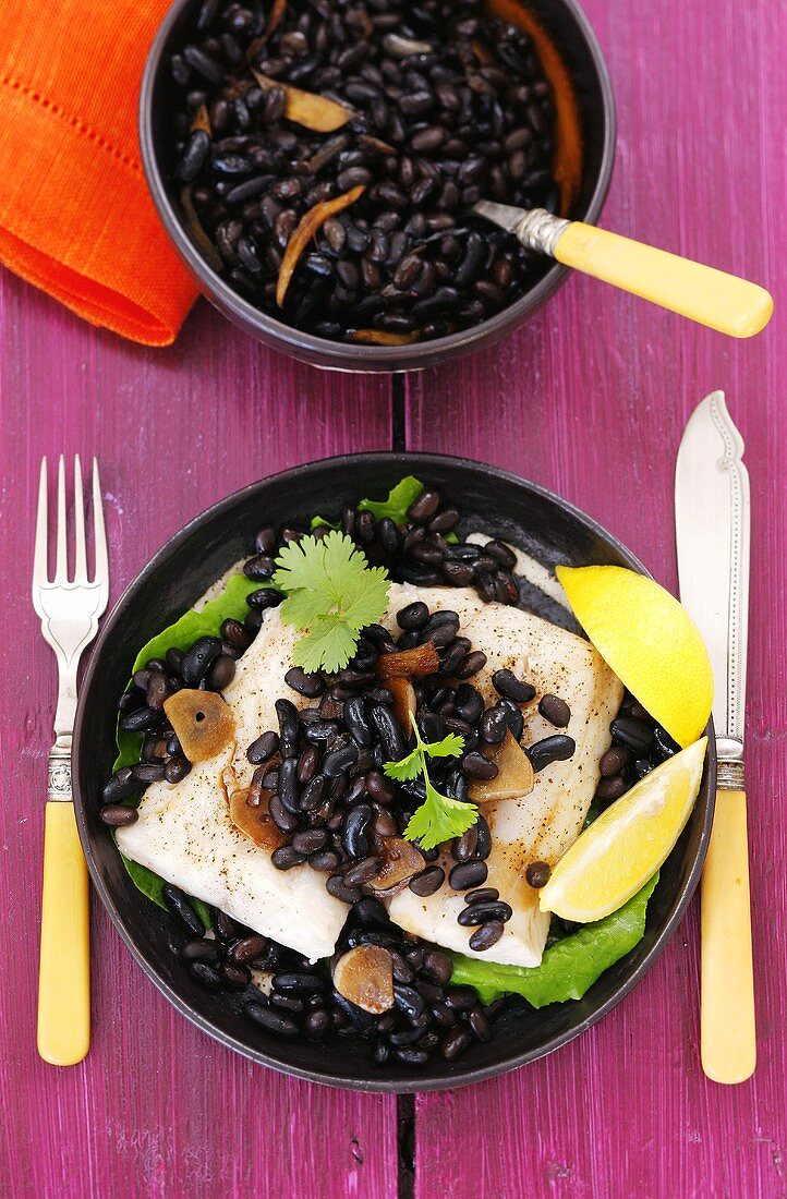Cod with black beans, garlic and coriander