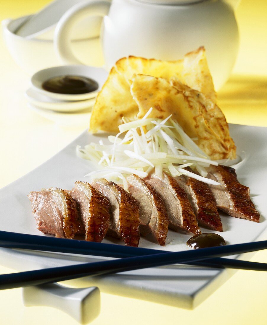 Peking duck with spring onions and pancakes