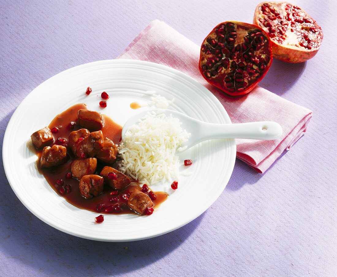 Chicken breast with pomegranate sauce and rice