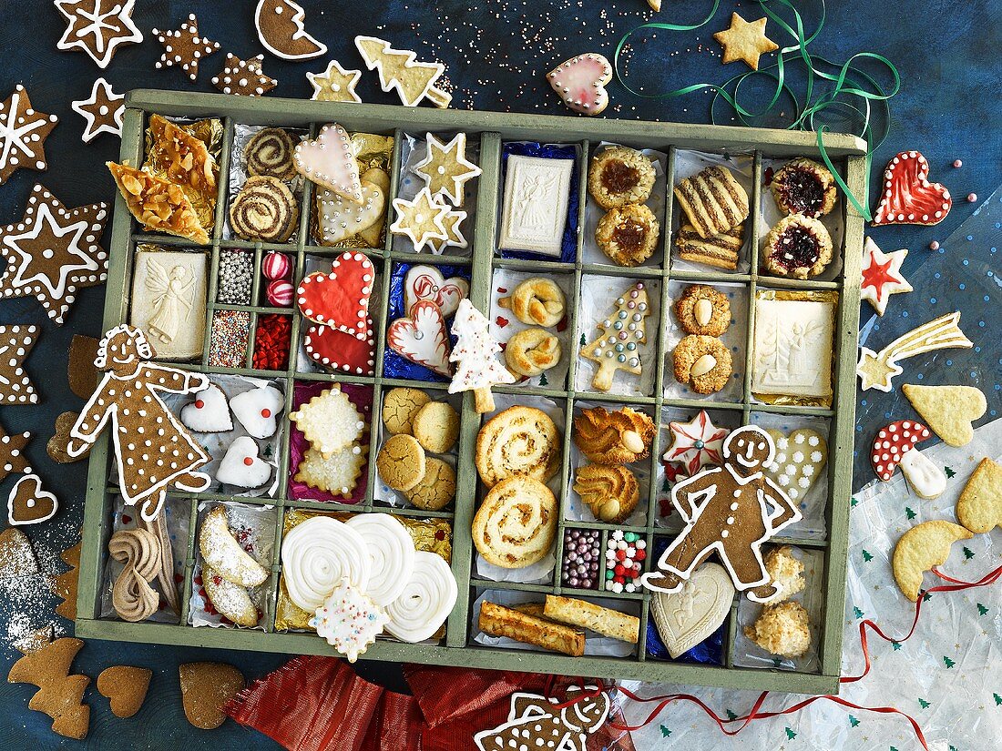 Many different Christmas biscuits in a type case