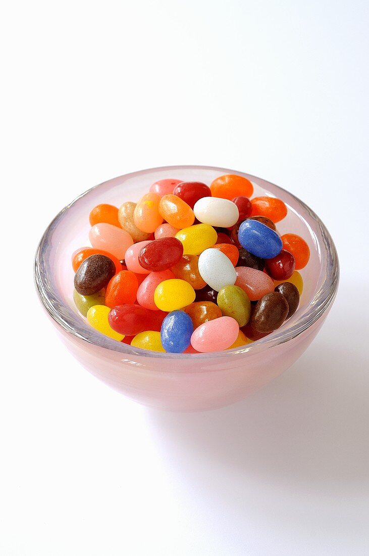Coloured sugar eggs in a glass dish