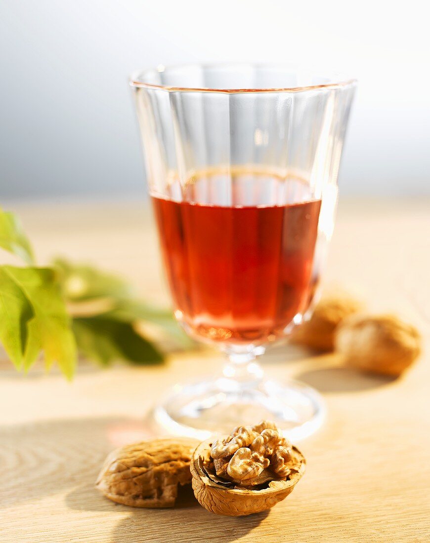 Glass of rosé wine and walnuts