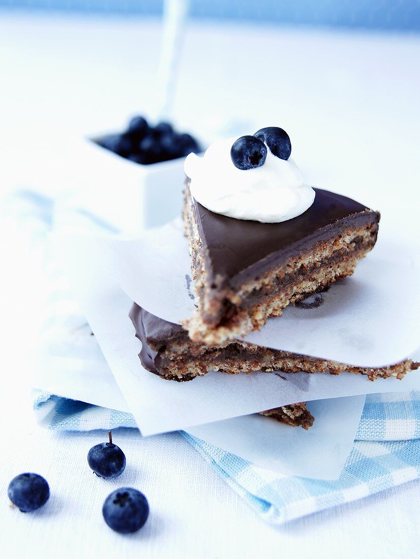 Chocolate cake with blueberries and cream