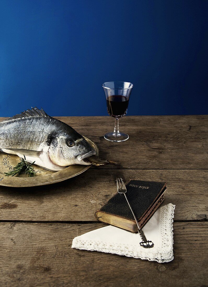 Fish, red wine & Bible (tradition of eating fish on Friday)