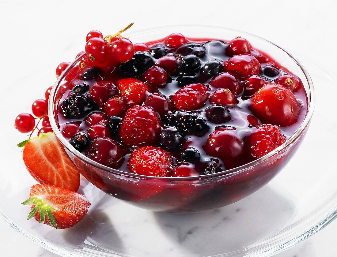 Red berry compote in a glass dish