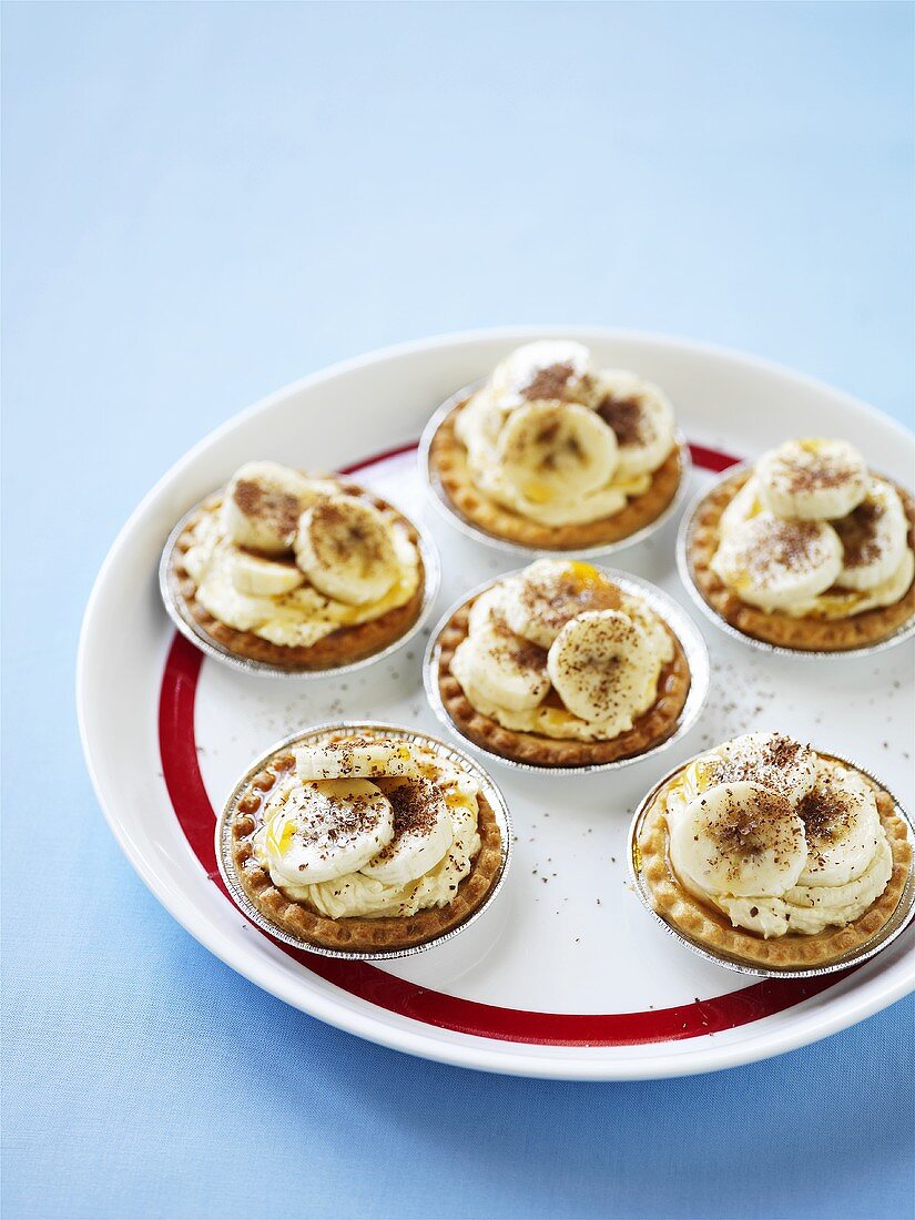 Several banoffee tarts on plate