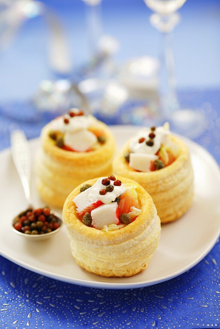 Surimi and smoked salmon vol-au-vents with coloured peppercorns