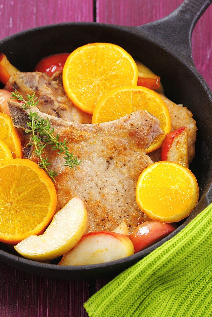 Pork chops with apples and oranges