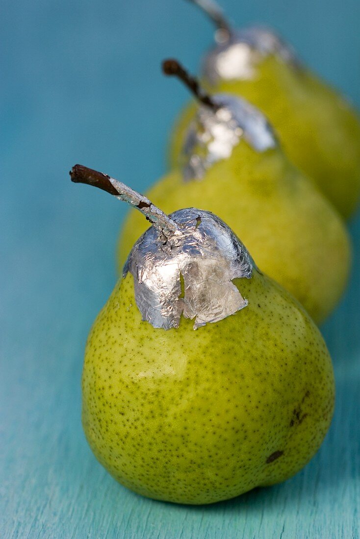 Three pears with silver leaf
