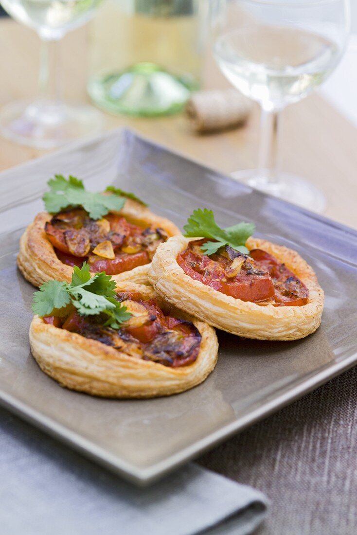 Tomato tarts on a baking tray