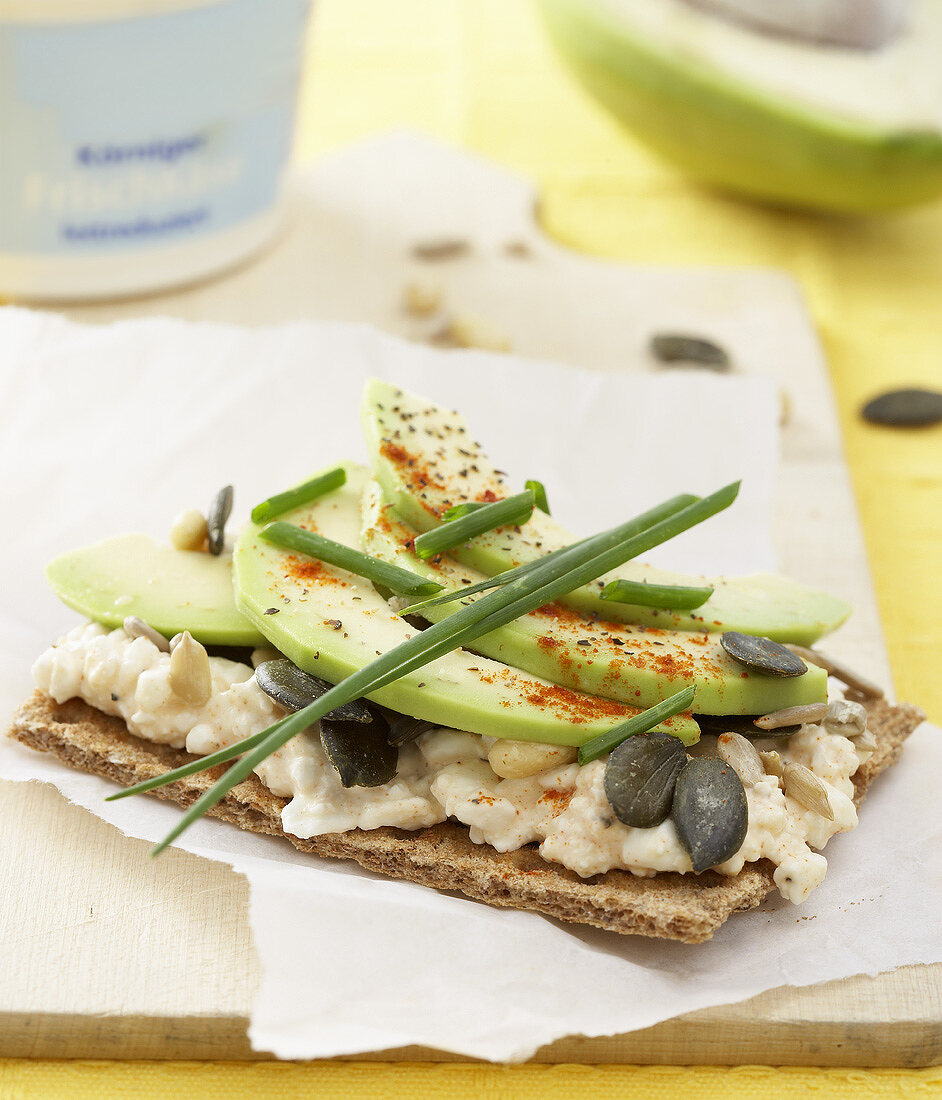 Crispbread topped with cottage cheese, avocado & pumpkin seeds