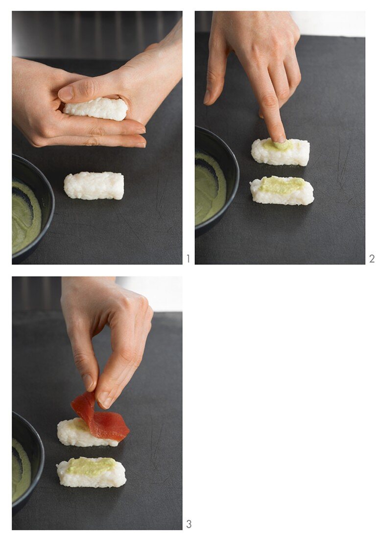 Preparing nigiri sushi with wasabi and tuna
