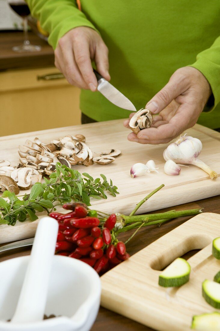 Slicing button mushrooms