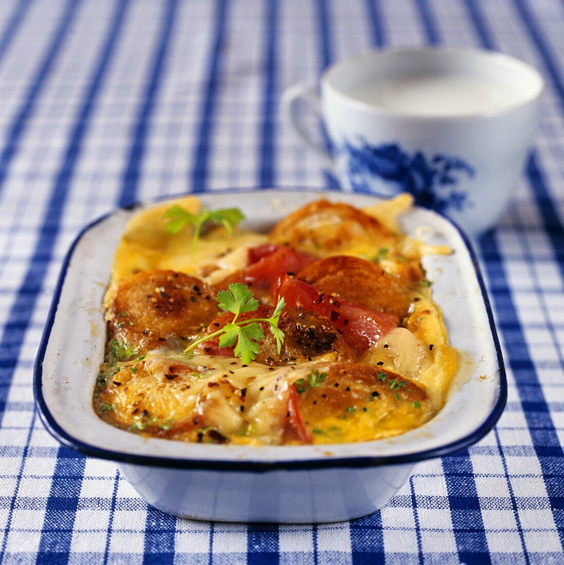 Savoury bread and butter pudding with tomatoes and cheese