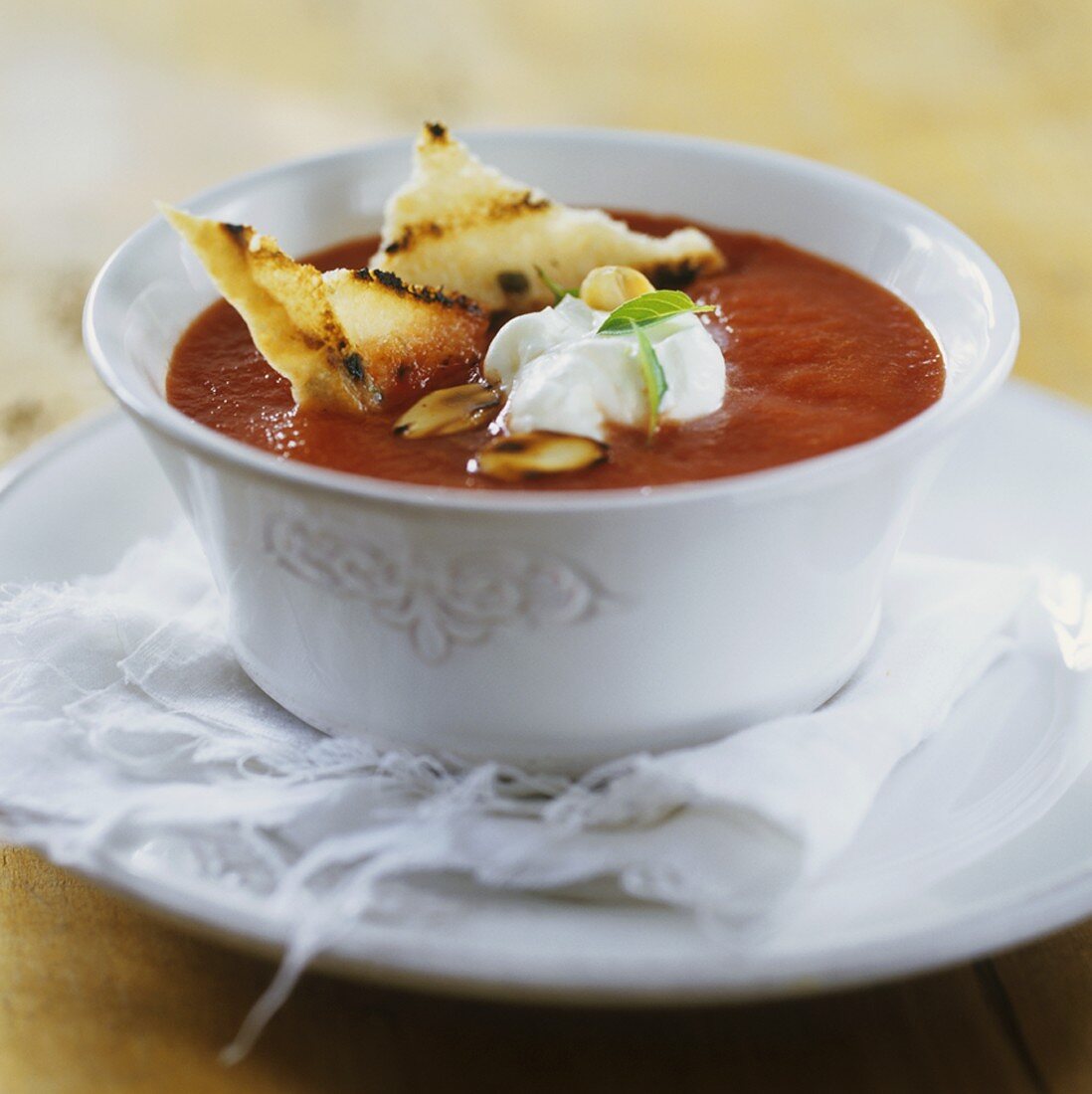 Tomato soup with crème fraîche and grilled bread