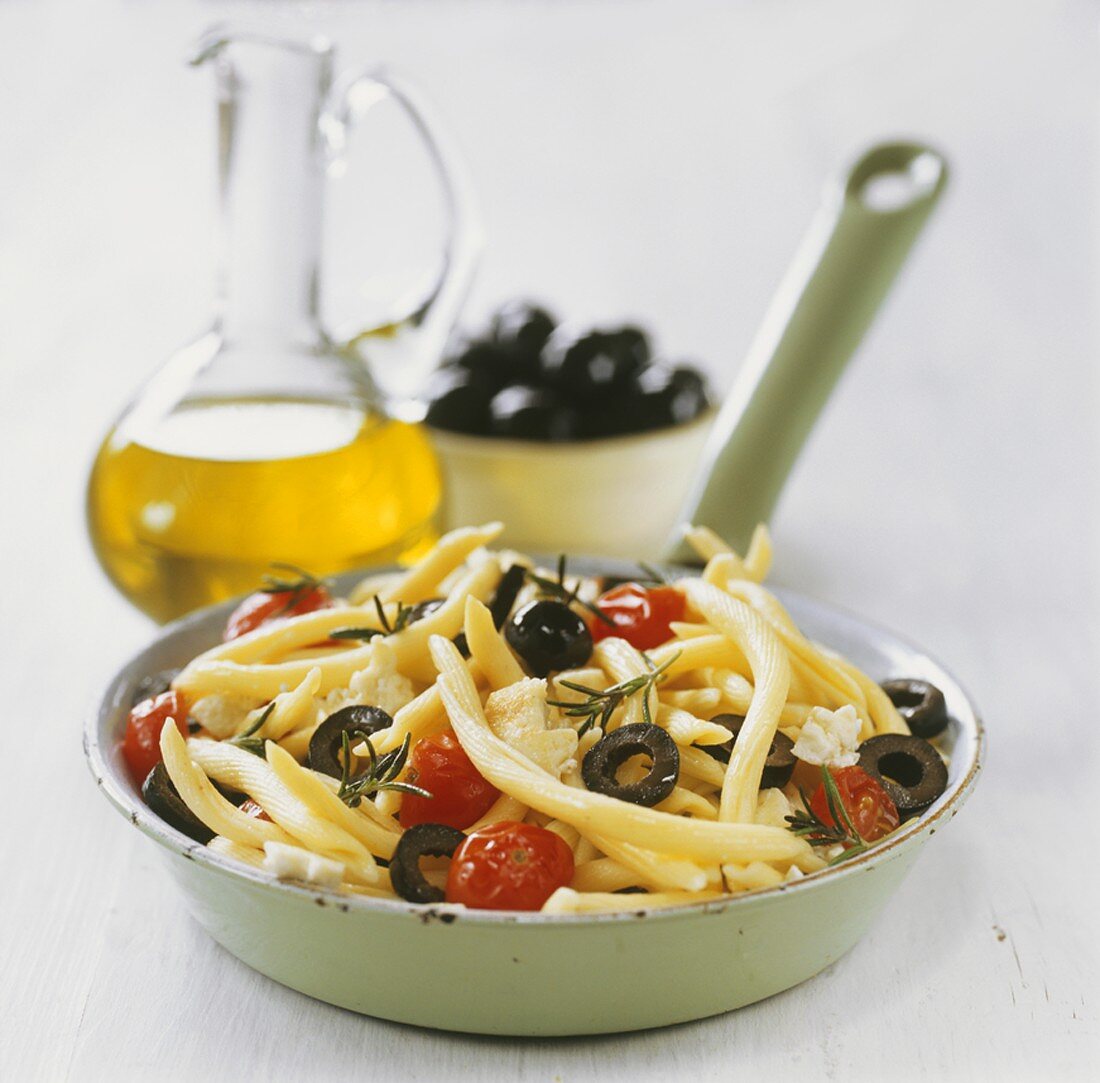 Pasta with black olives, cocktail tomatoes and feta