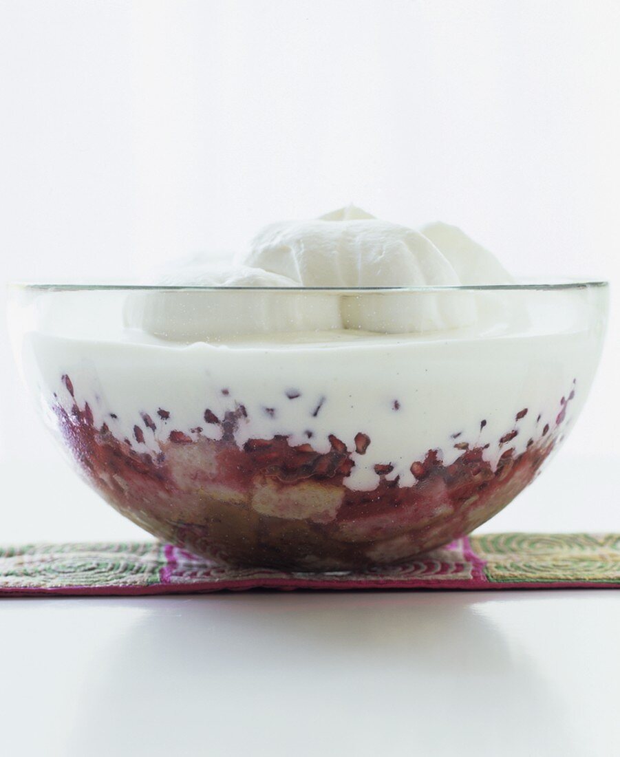 Vanilla and pomegranate trifle in a bowl