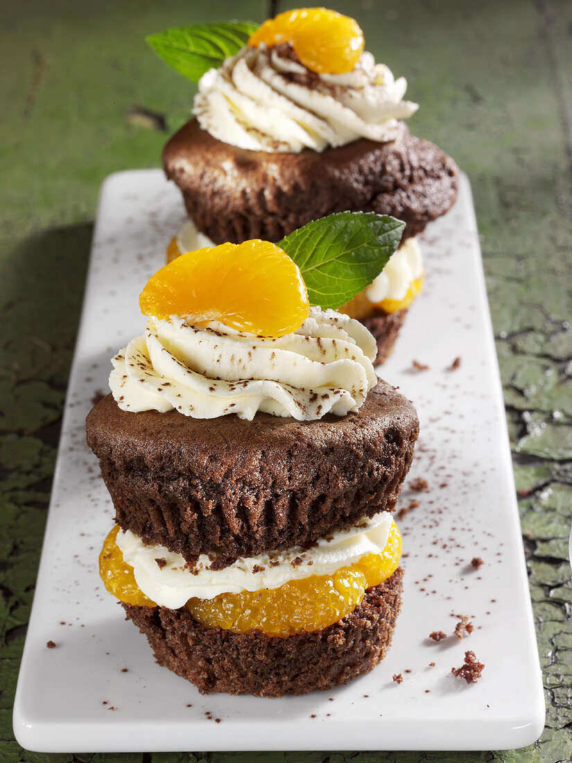 Mocha muffins filled with cream and mandarin oranges