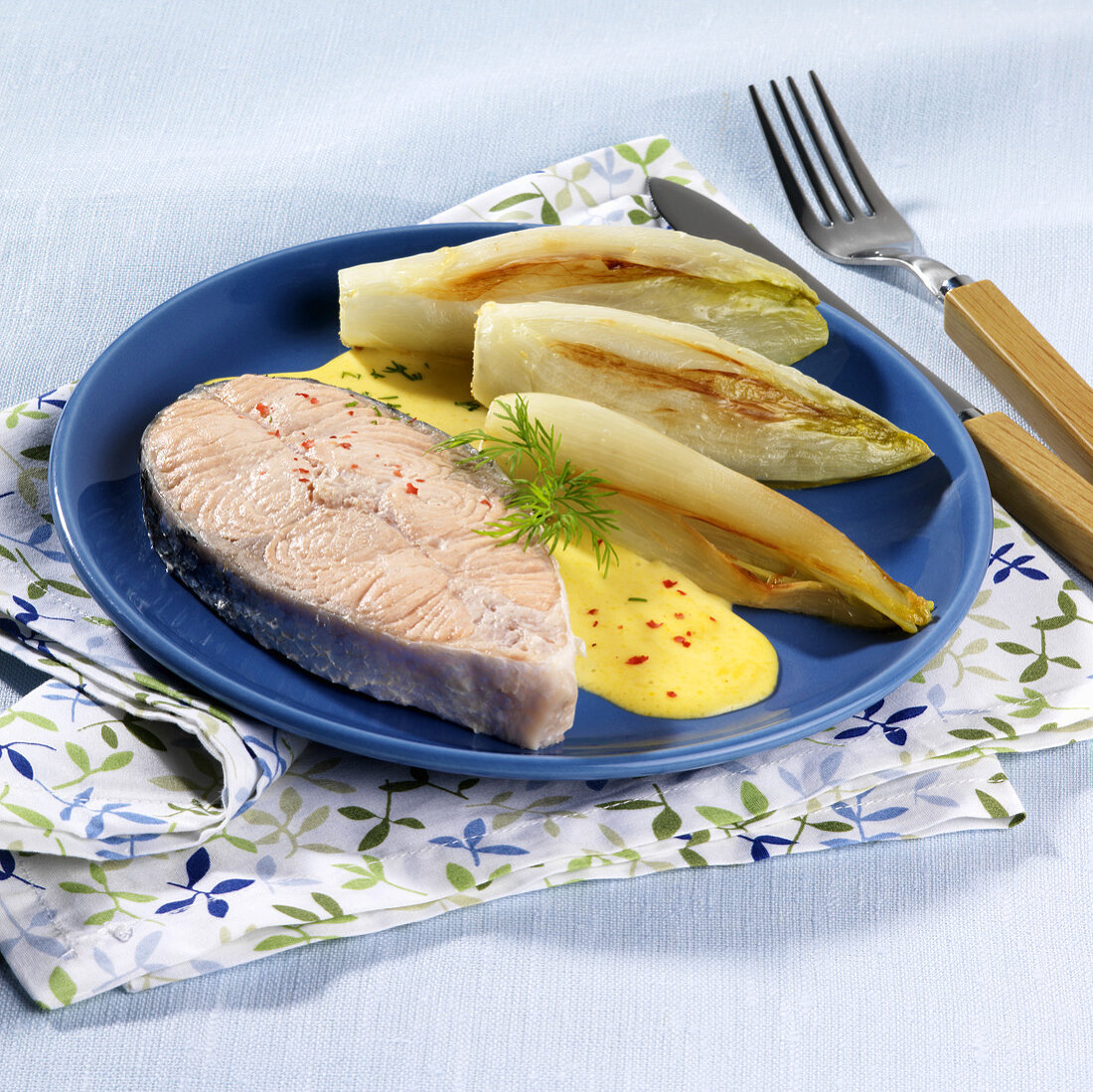 Salmon with fried chicory and dill sauce