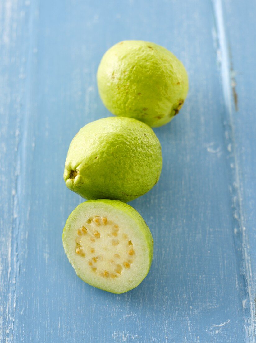 One half and two whole guavas