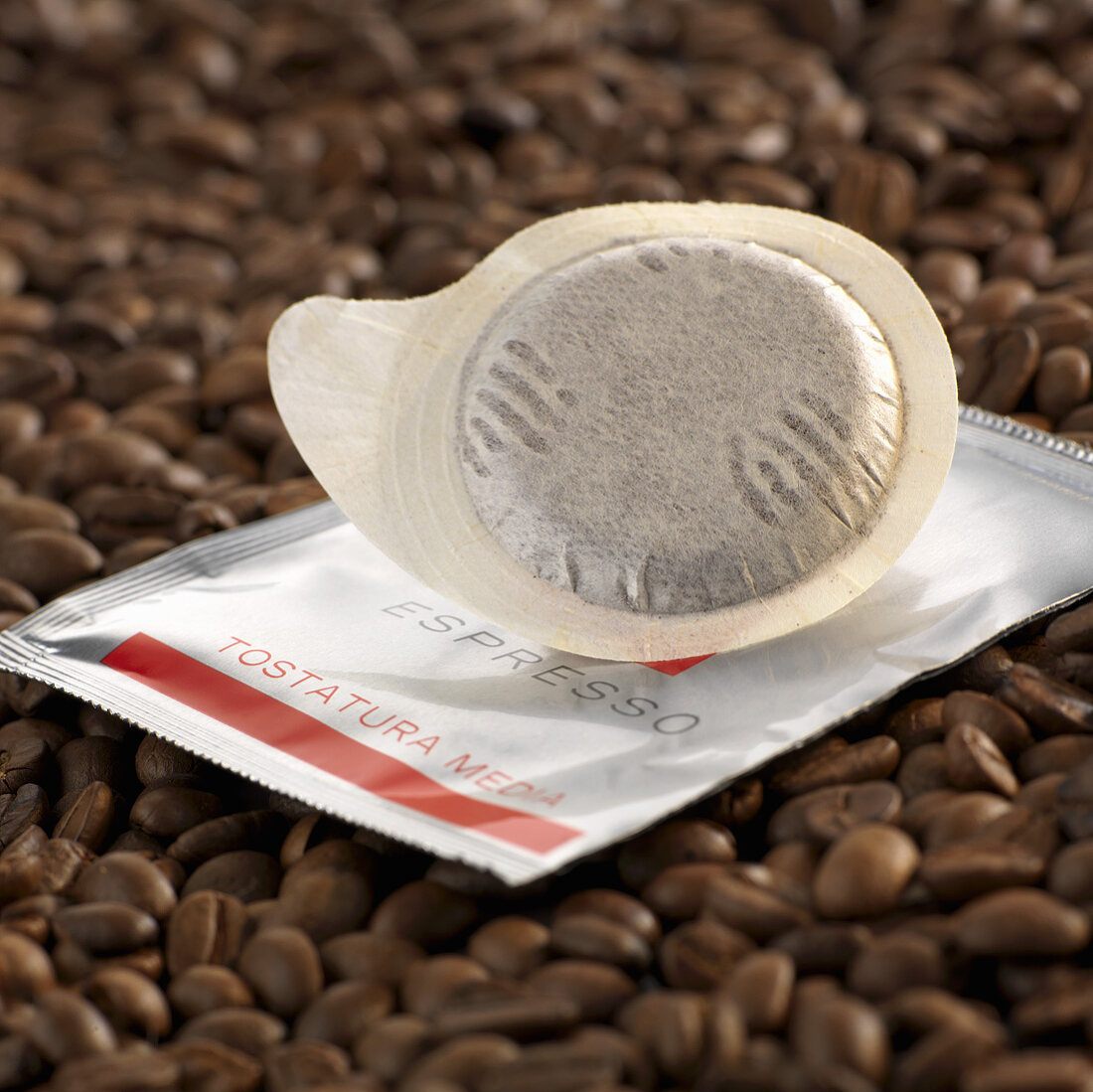 Espresso pod on coffee beans