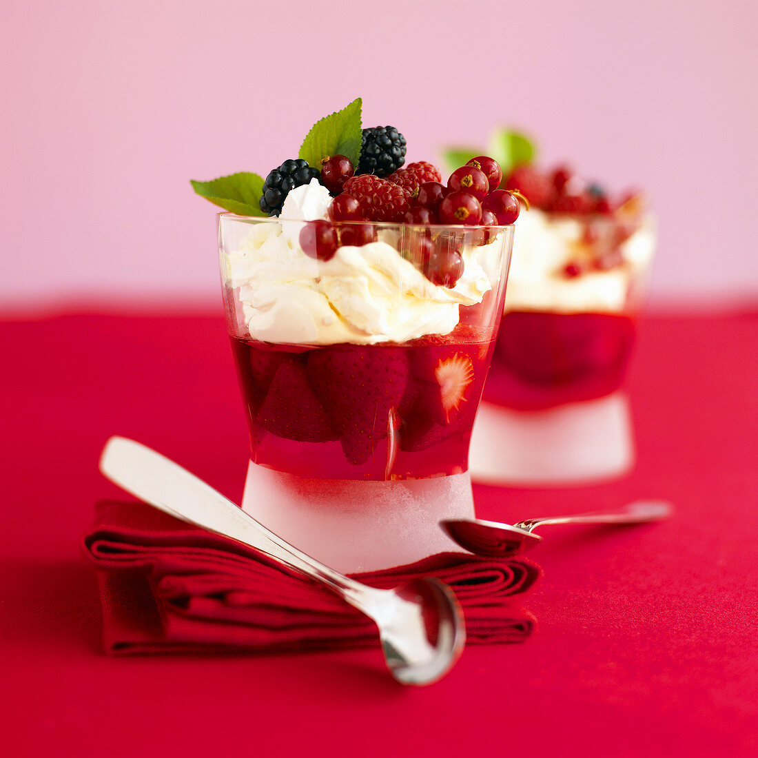 Berry jelly with cream in glasses