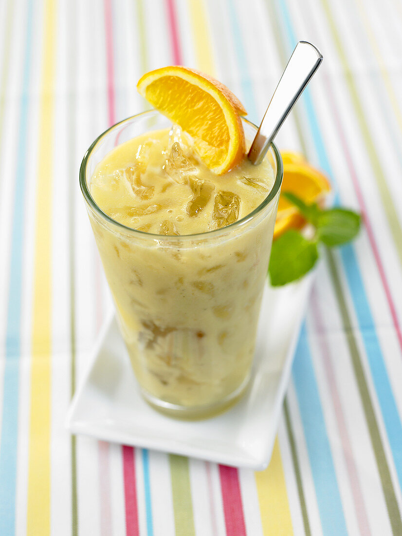 Orange and pineapple smoothie with coconut syrup
