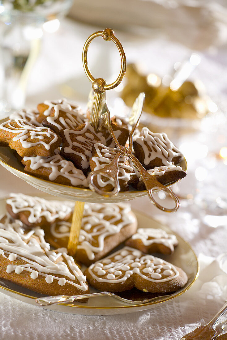 Decorated ginger biscuits on tiered stand (for Christmas)