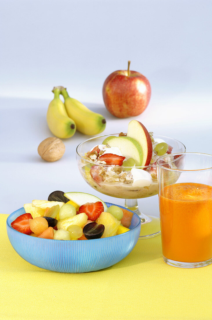 Fruit salad, muesli and fruit juice