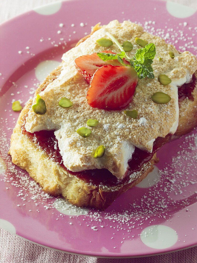 French toast with meringue topping and pistachios