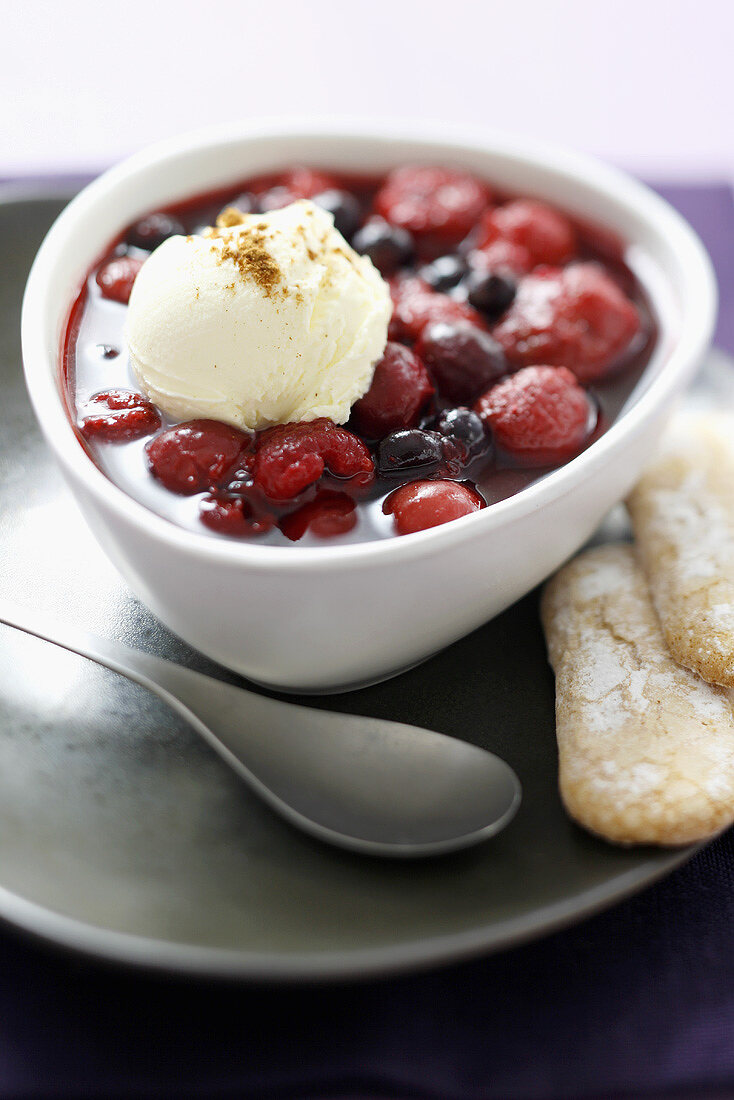 Frozen berries in honey syrup with mascarpone ice cream