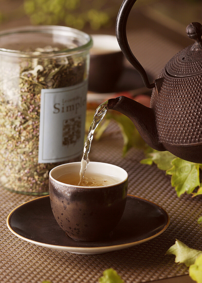 Pouring herb tea