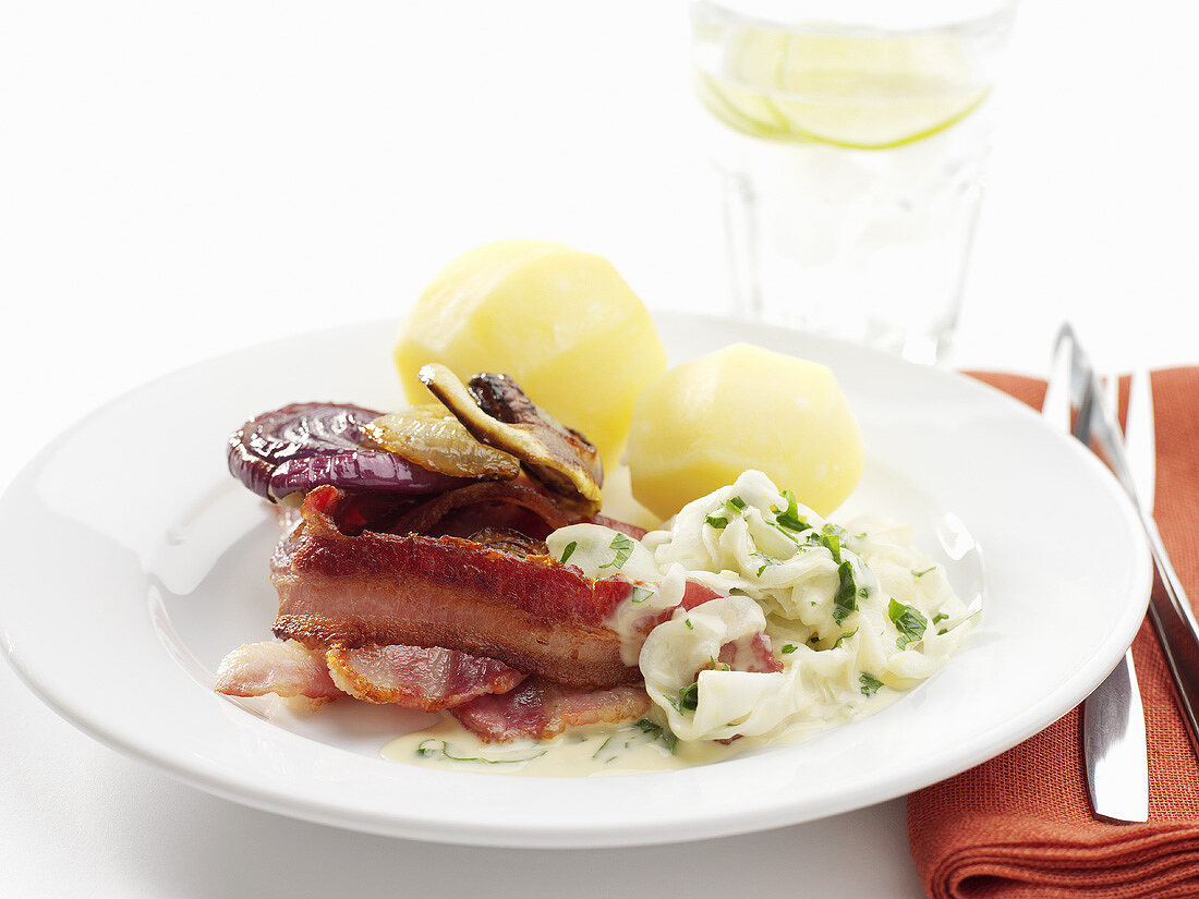 Fried bacon with onions and boiled potatoes