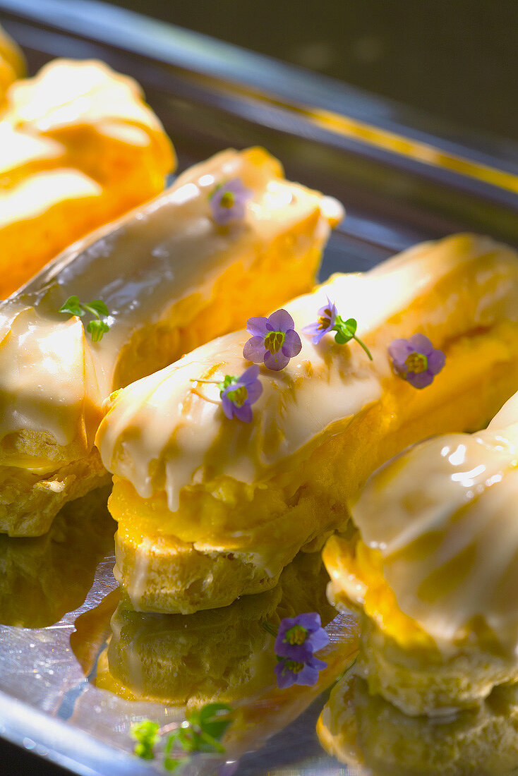 Iced éclairs filled with toffee cream