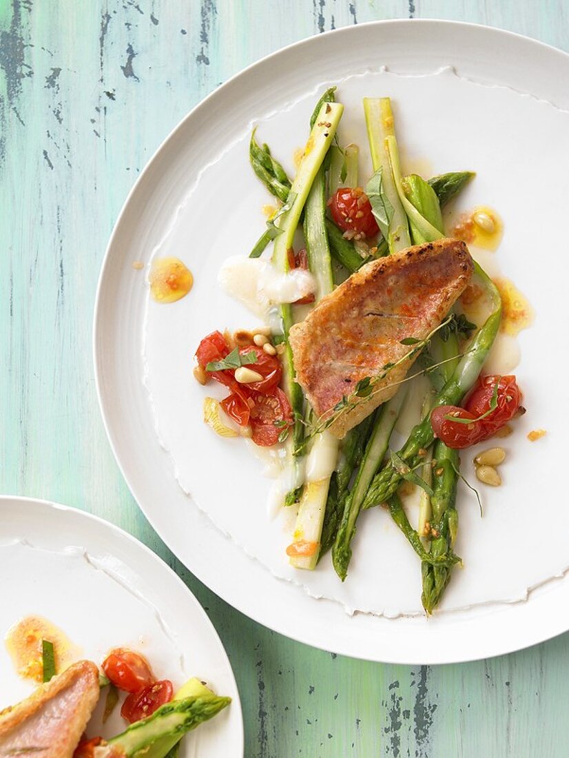 Red mullet on green asparagus and Taleggio cheese