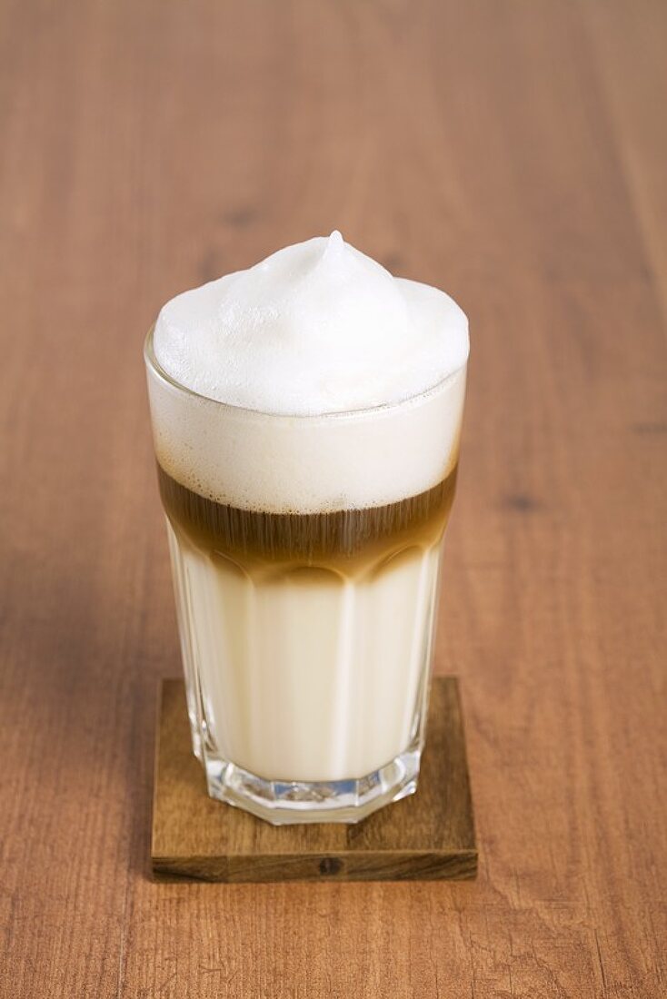A glass of latte macchiatto