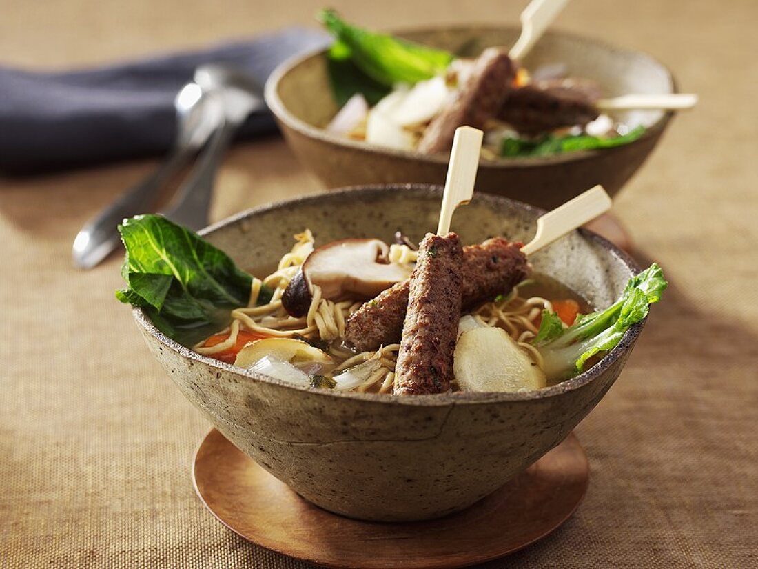 Noodle soup with lamb skewers