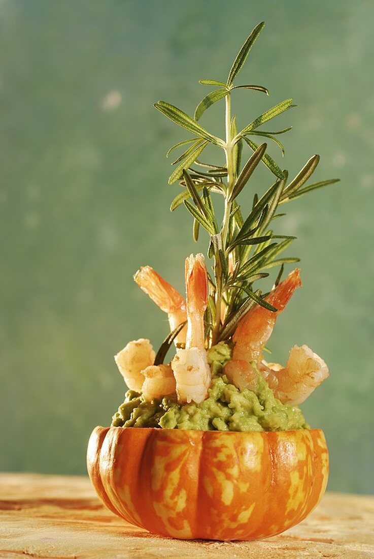 Guacamole with prawns and rosemary in hollowed-out pumpkin