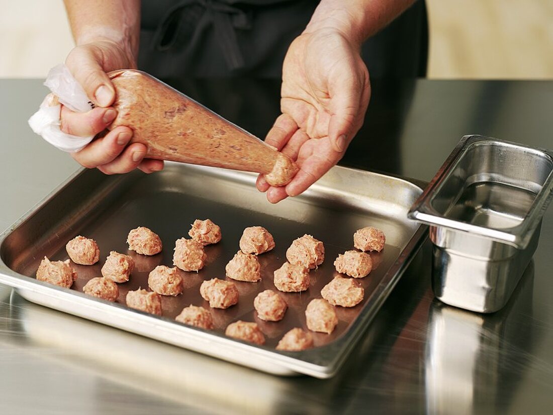 Making meatballs with a piping bag