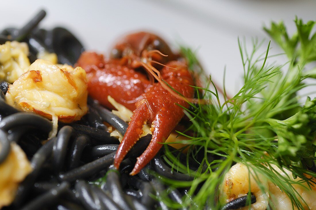 Black spaghetti with seafood and herbs