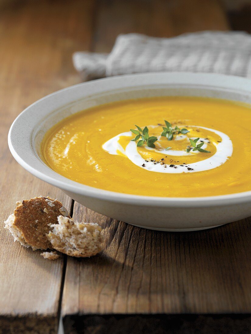 Pumpkin cream soup with yoghurt and thyme