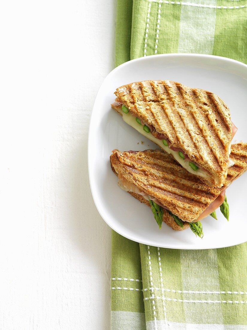 Green asparagus, ham and cheese in toasted sandwich